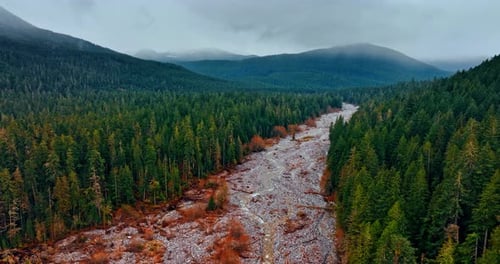 Rocky valley with narrow wavy streams running by.