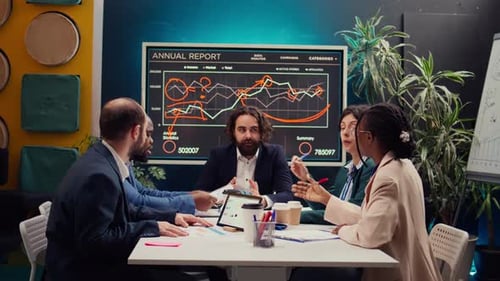 Professionals Discussing Business Data at Office Meeting