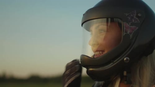 Woman Removing Helmet After Skydiving Adventure