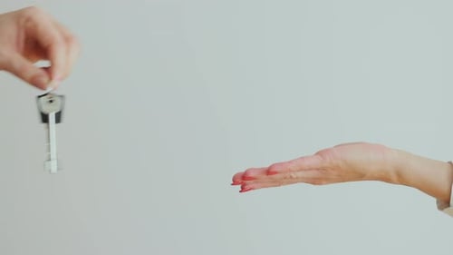 Giving Key to another Hand