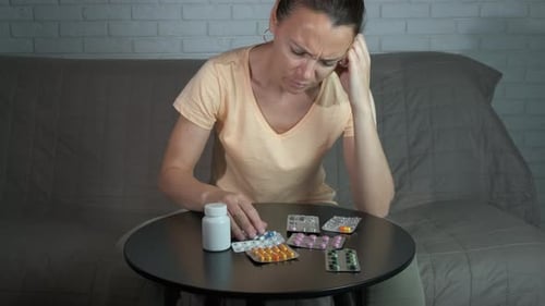 Woman Considers Medication at Home