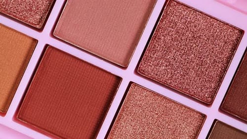 Multi colour eye shadow palette closeup.