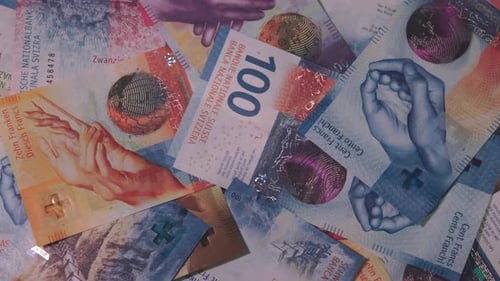 Close-up of Swiss Franc Banknotes Abstract Pattern