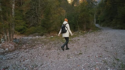 Beautiful Female Traveler Walks Through the Forest to the Mountains Incredibly Beautiful Views in