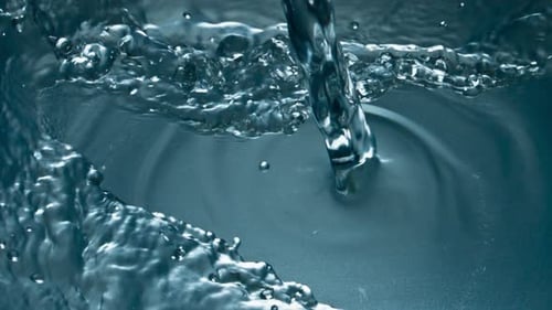 Cold Water Pouring Glass Top View Closeup