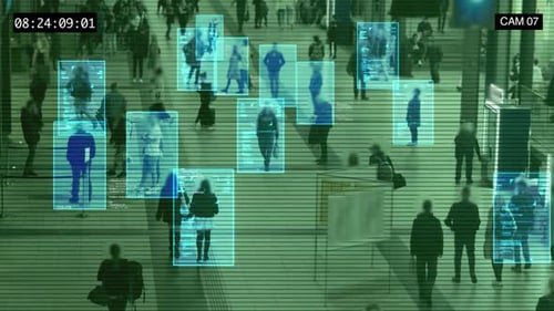 Surveillance camera interface that scans people's faces in a crowded public place.