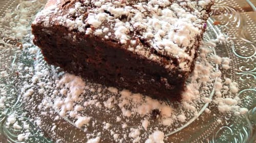 Tasty brownie with powdered sugar on a crystal plate in Marbella Spain, sweet cake dessert