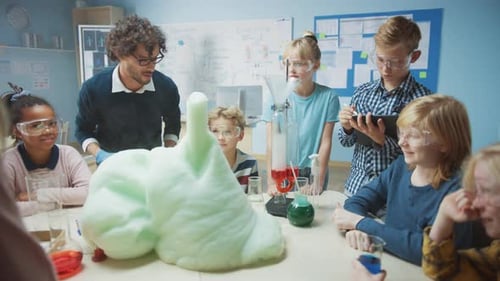 Elementary School Science / Chemistry Classroom: Enthusiastic Teacher Shows Funny Chemical Reaction