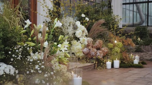 Wedding Venue Decorated with Floral Arrangement and Candles
