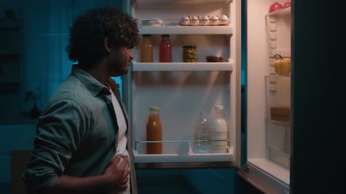 Indian Man Arabian Guy Hispanic Male at Home at Dark Kitchen in Evening at Night Open Fridge Search