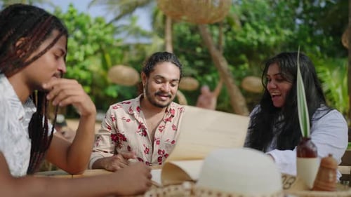 Diverse LGBTQ Friends Engage in Conversation at Beachside Eatery Multiracial Group Selects Meals