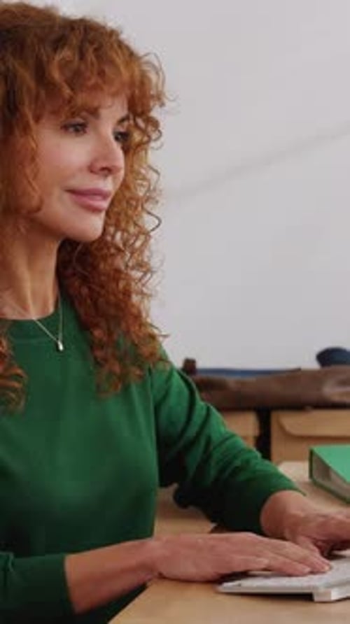 Mid Adult Businesswoman Working on Desktop Computer at Home Office