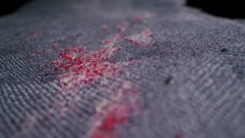 Closeup of Dirty Denim Fabric Showcasing Stains Texture and Unique Details for a Visual Experience