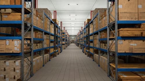 Industrial Warehouse Filled With Storage Boxes Labeled For Shipment