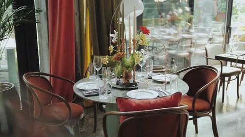 Enjoy a Chic Dining Experience in a Trendy Restaurant Filled with Art and Elegance