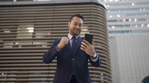 Successful Businessman Celebrating Achievement Outdoors