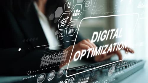 Business professional engaged in digital optimization with graphics and data visualization on screen