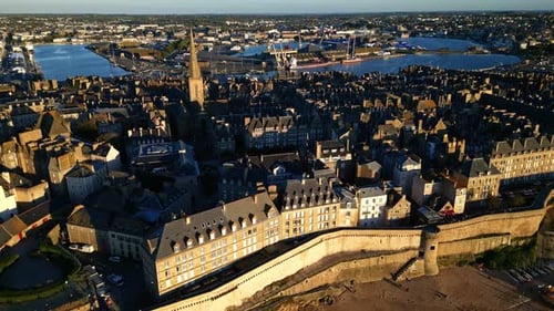 Saint-Malo Intra Muros landscape at sunset, Saint Malo, Brittany in France. Aerial drone backward