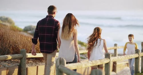 A family walking to the beach together