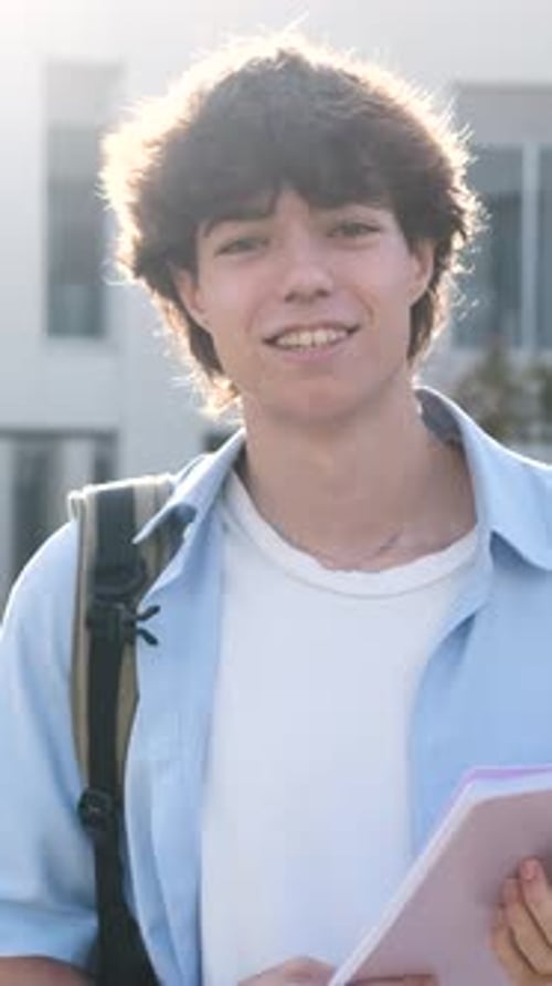 Student Smiling and Posing Outside School