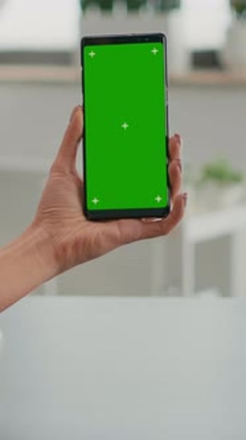 Vertical Video Business Woman Browsing on Internet Using Mock Up Green Screen Chroma Key Smartphone