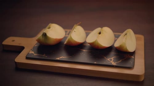 Beautifully Sliced Apples Artfully Arranged on an Elegant and Stylish Cutting Board Display