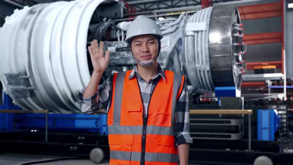 Asian Male Engineer Smiling To Camera And Waving Hand Saying Bye With ...
