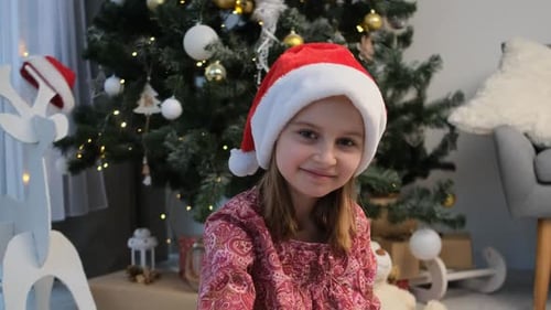 Charming Girl Poses in Festive Christmas Scene