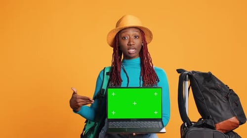 Young Adult Pointing at Laptop Display