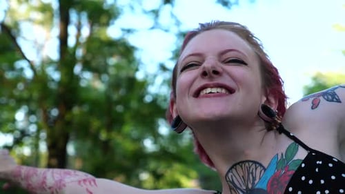 Close Up to Head of Happy Punk Girl with Pink Hair Enjoying Trip While Riding on Vehicle Through