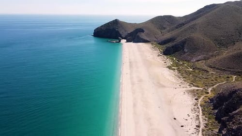 Seashore, coastline, scenic view of people at unspoiled beach in Almeria, called Playa de los Muerto