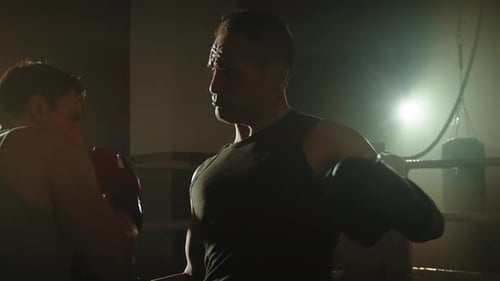 Two Fighter Hit with Punch at the End in the Rung of the Gym