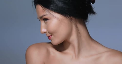 Woman Applies Makeup with Brush Close-Up