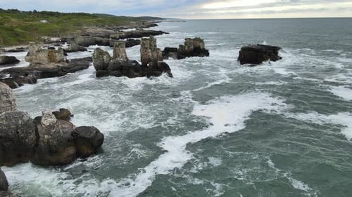 Turbulent Ocean Waves Crashing on Rocky Coastline