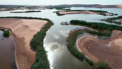 Aerial View of Desert Landscape with Scattered Lakes