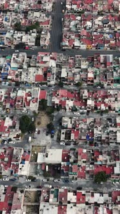 Vertical drone footage showcasing a populated neighborhood in Ecatepec, Mexico