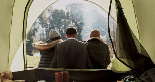 Friends Camping in a Tent by the Lake