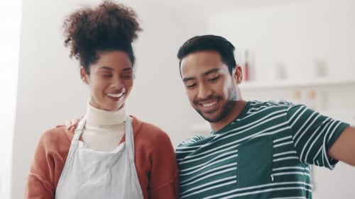 Romantic Couple Hugging in Kitchen After Flower Gift