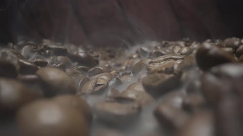 Coffee Beans Roasting with Smoke Close Up