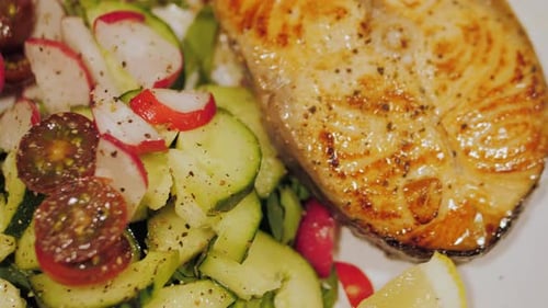 Close Up of Salmon Steak and Garden Salad