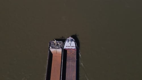 Bird's eye view of Empty Cargo Boat entering frame, Cologne Germany