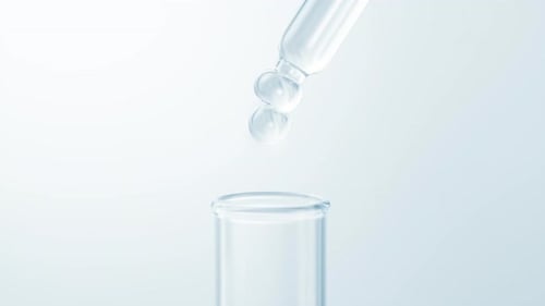 Science Experiment Liquid Dropping into Glass Test Tube