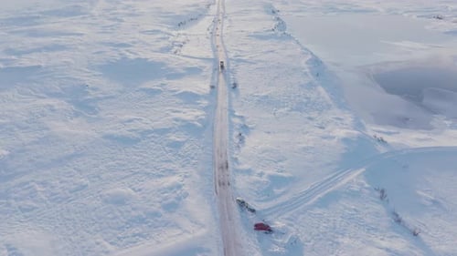 Tilt down aerial view depicting winter scenery, drone smooth look down