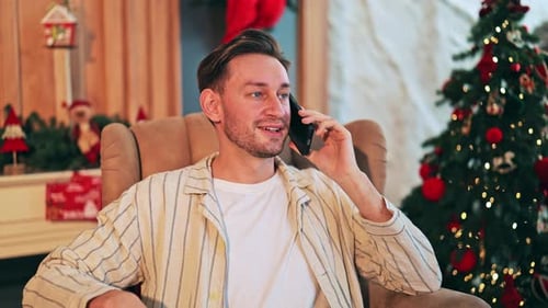 Man Chatting on Phone at Christmas