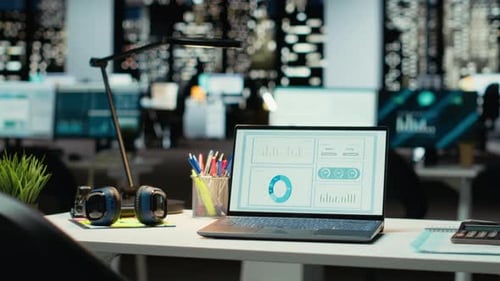 Empty Corporate Boardroom at Night with Digital Display of Performance Metrics