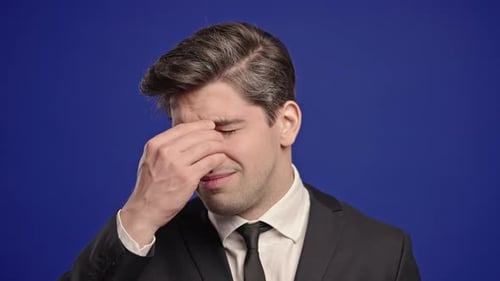 Man Suffering from Headache in Suit Close-up