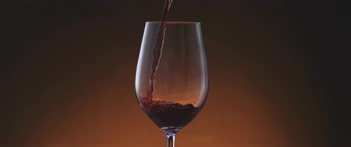 Pouring Red Wine into Glass Close Up