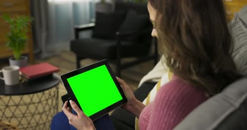 Woman Avid Online Shopper Exploring Various Ecommerce Websites and Adding Items to Her Virtual Cart