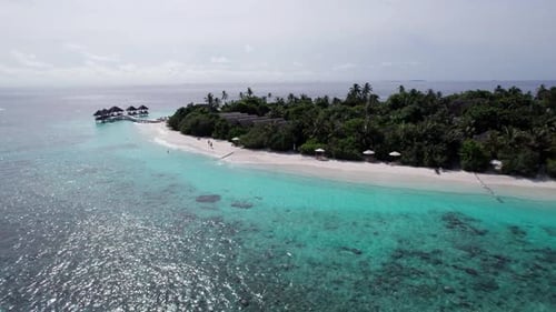 Turquoise Clear Water and Green Island of Maldives