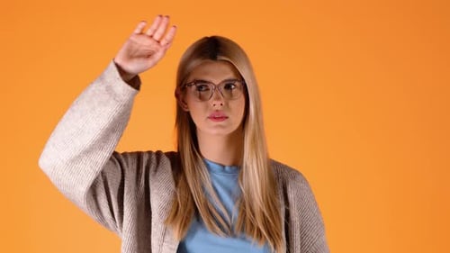 Woman Sneeze in Tissue on Orange Background